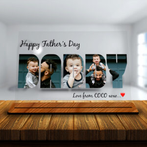 Customized acrylic photo plaque for Father’s Day with “DADDY” text filled with personal photos and wooden base.